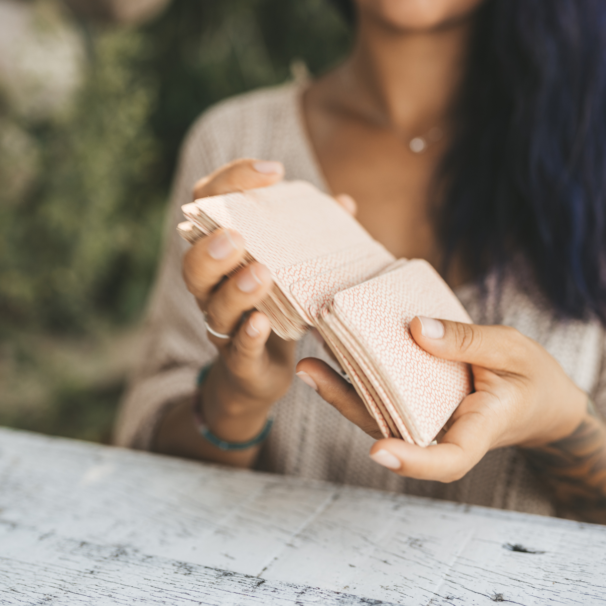 Woman shuffling tarot cards